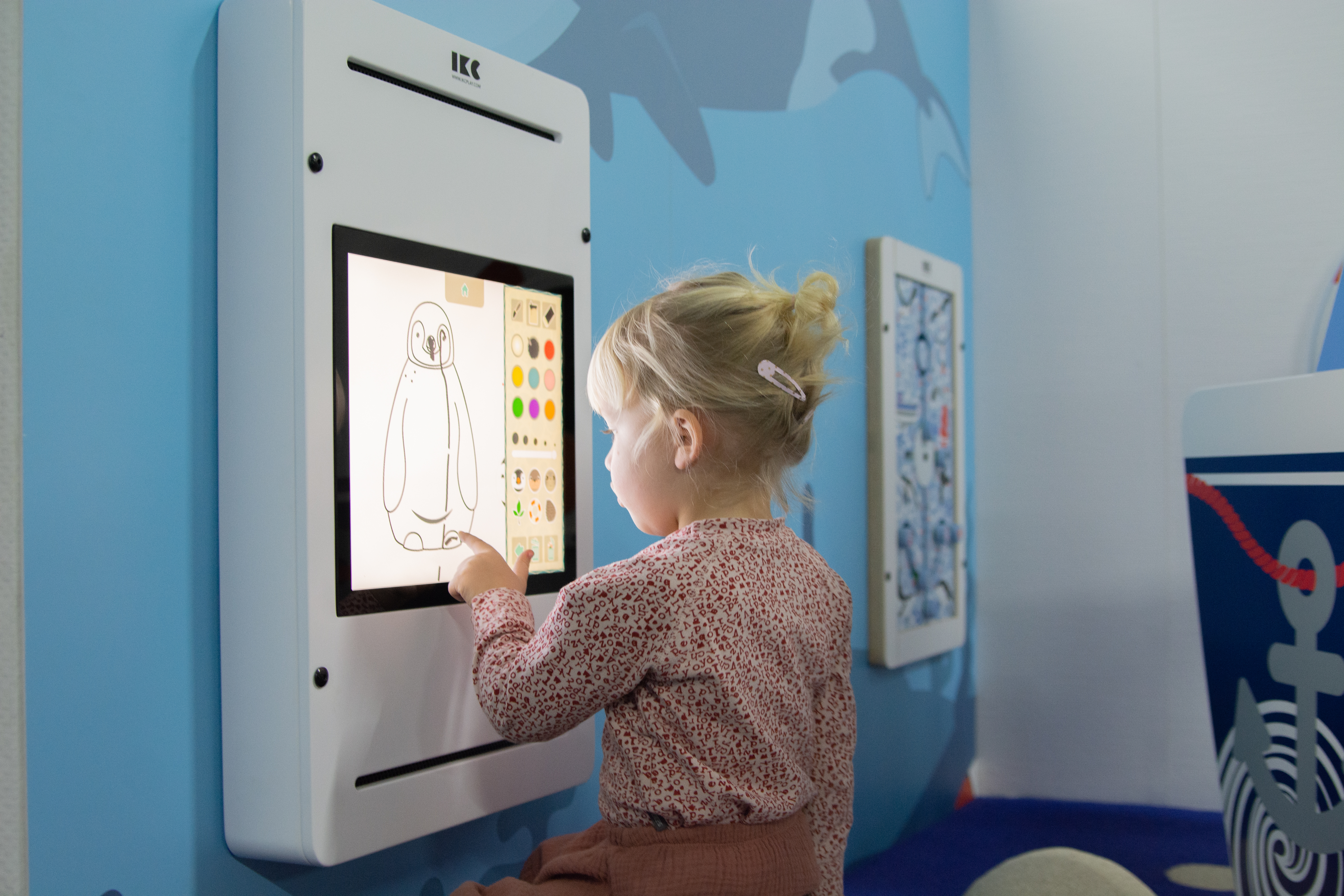 Girl playing with interative wall 